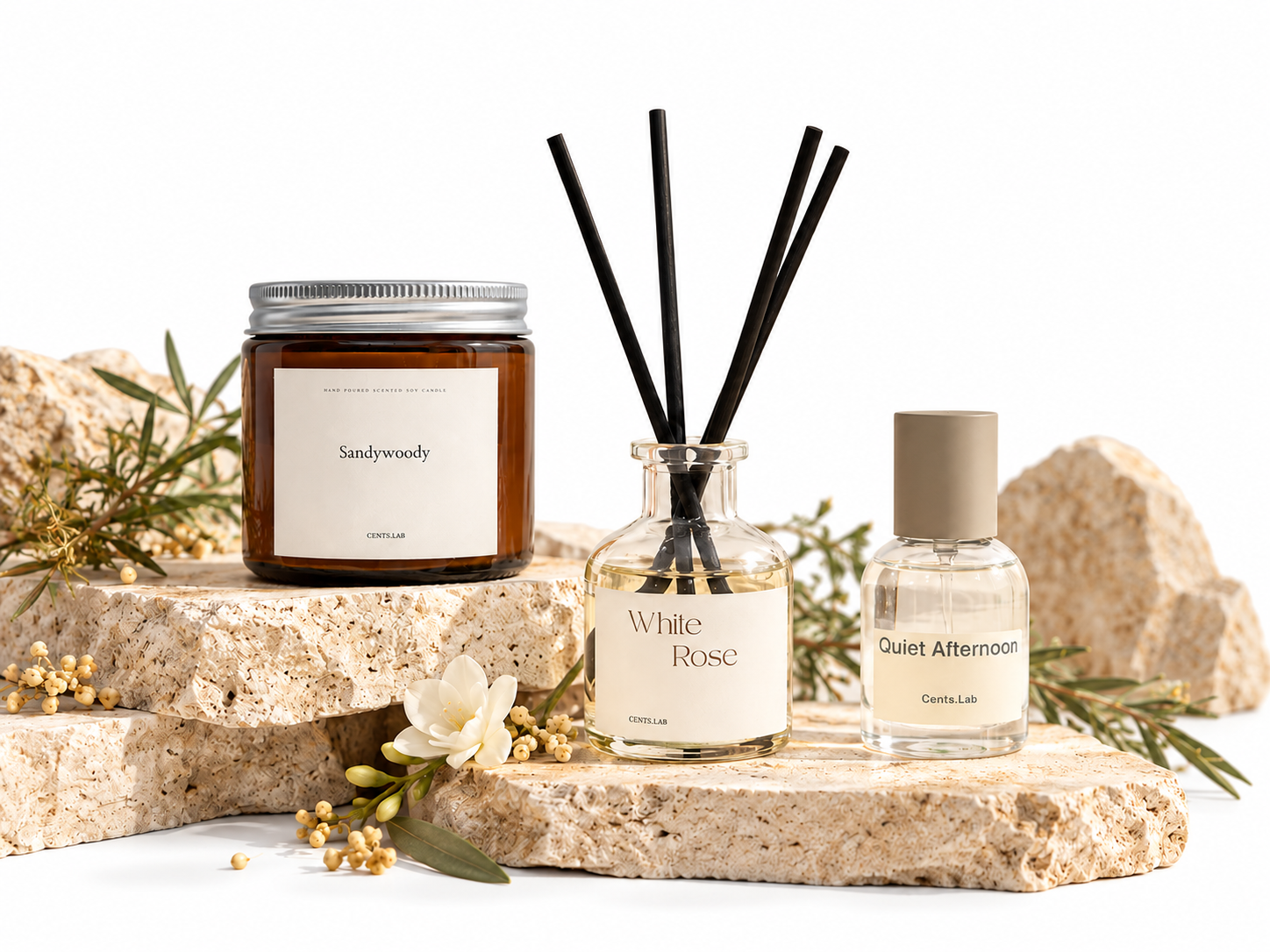 Cents.Lab candle, White Rose reed diffuser and Quiet Afternoon perfume on natural stone
